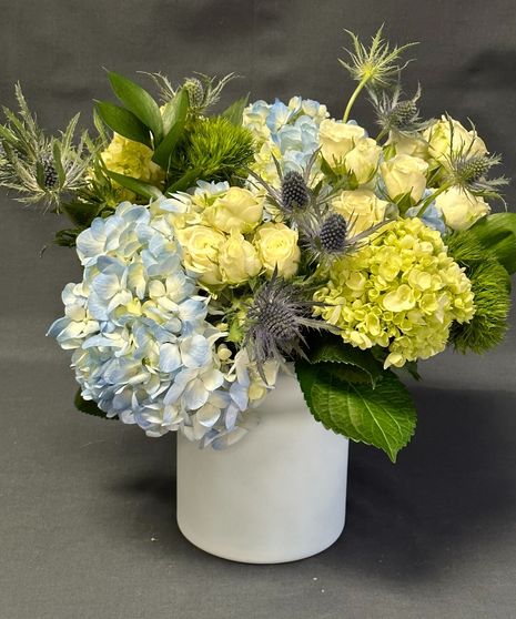 blue floral arrangement with blue thistle and hydrangea