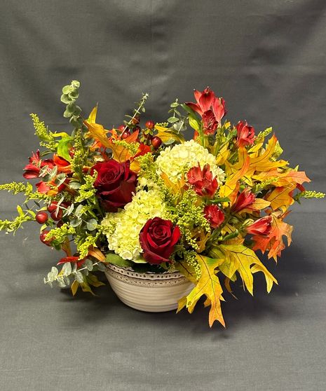 into the woods themed fall floral arrangement